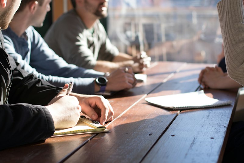 Team reviewing strategy notes around a table